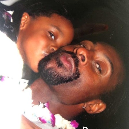 Jada Symone Rice kisses her father Jerry Rice.